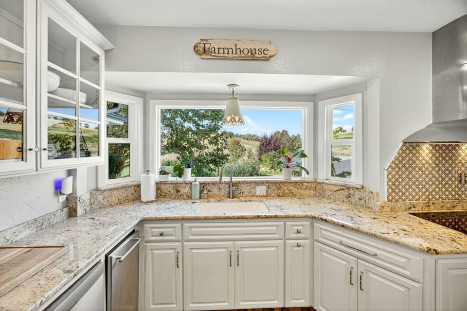 Farmhouse kitchen with picturesque views of the property