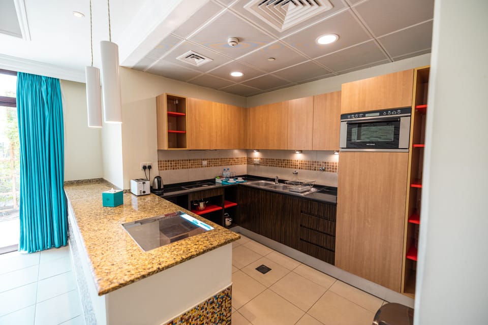 Two Bedroom Garden Pool view | In-room safe, laptop workspace, free WiFi, bed sheets