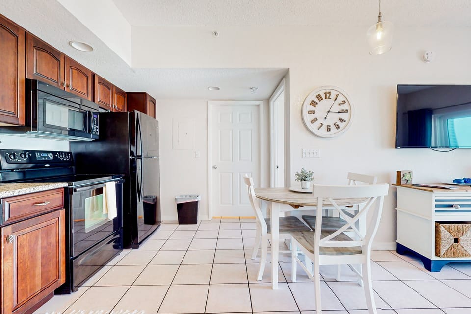 This beach stay features a bright kitchen and cozy dining area with modern appliances and coastal charm. Ideal for casual meals, morning coffee, or winding down after a fun-filled day at the beach.