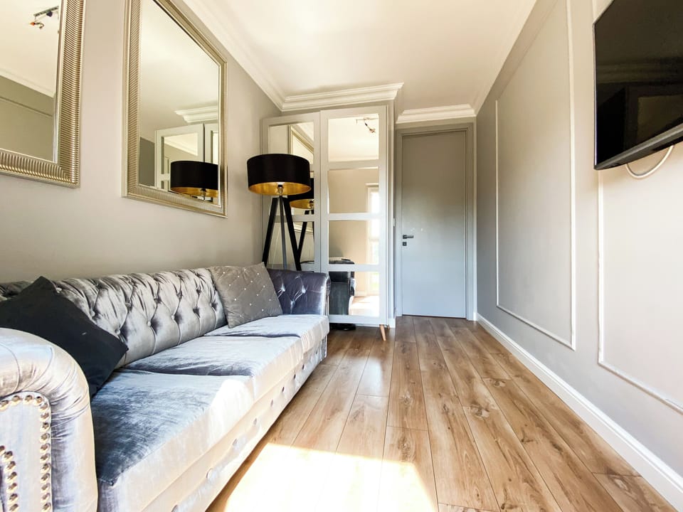 Luxury Apartment, Courtyard View | Living area | Flat-screen TV