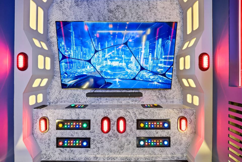 Experience adventure in our vibrant entertainment area, complete with a large flat-screen TV for immersive viewing. The stylish console and dynamic lighting create a unique atmosphere, ideal for movie nights or gaming marathons.