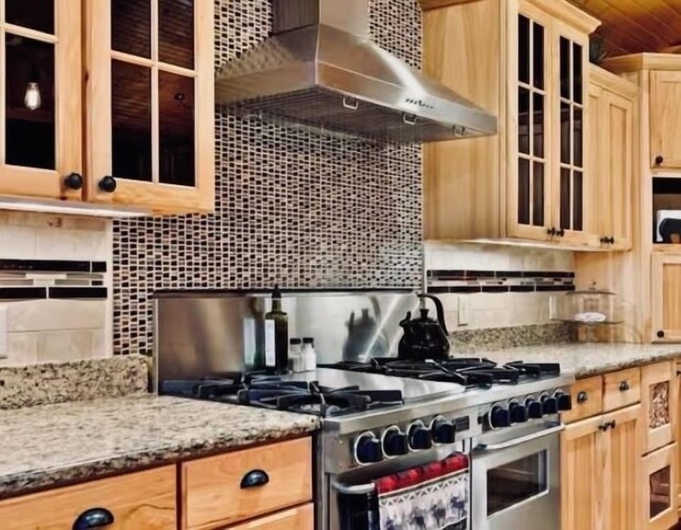 Double gas ovens with a gas range and griddle, making breakfast prep a delight.