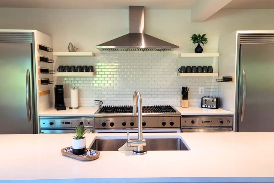  Gourmet kitchen with cooking utensils, double oven , microwave, coffee maker