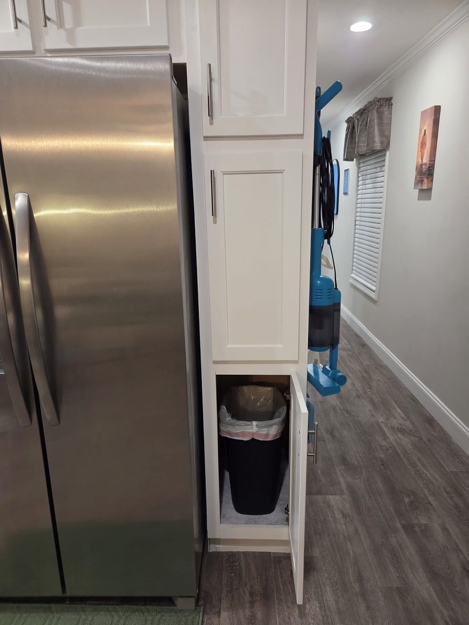 trash bin is inside cabinet 
