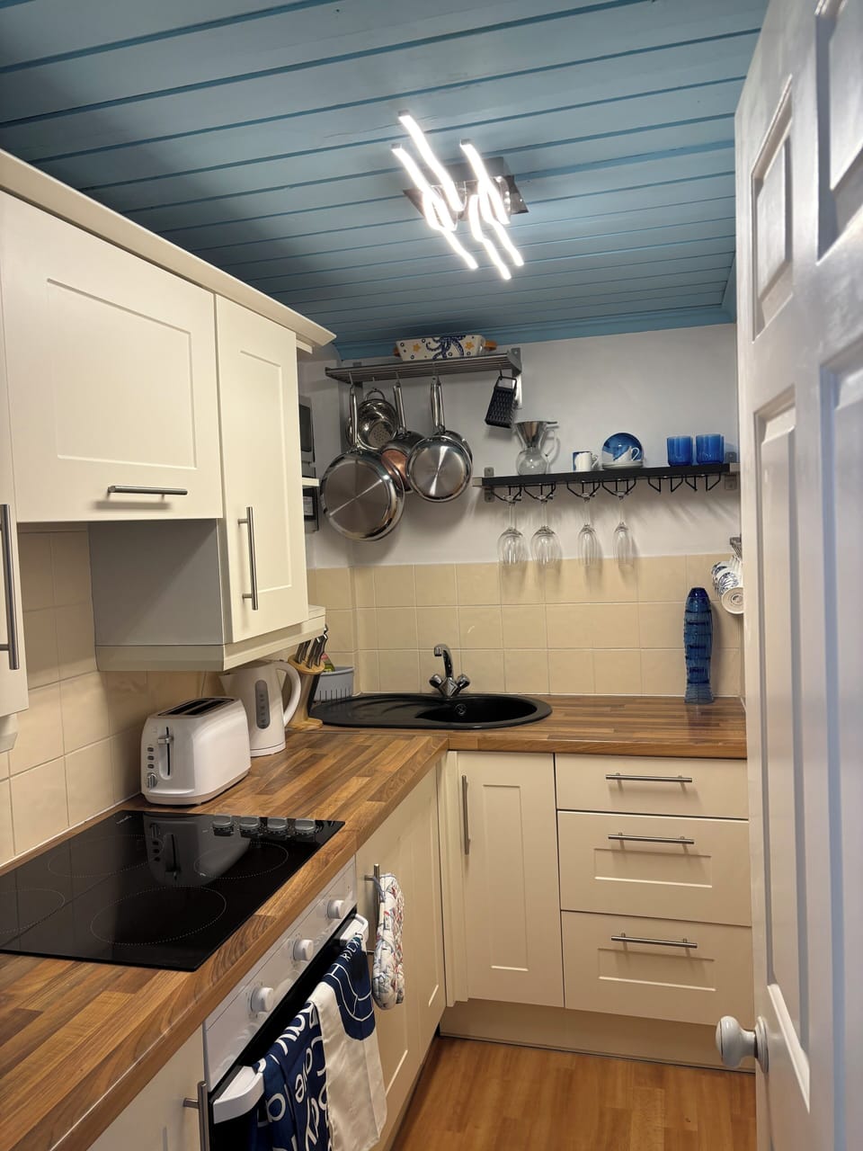 Well equipped galley kitchen with Cornish designed pieces