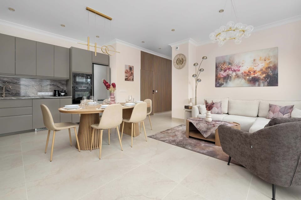 Enjoy your favorite shows on the flat-screen television in the elegant living area.
