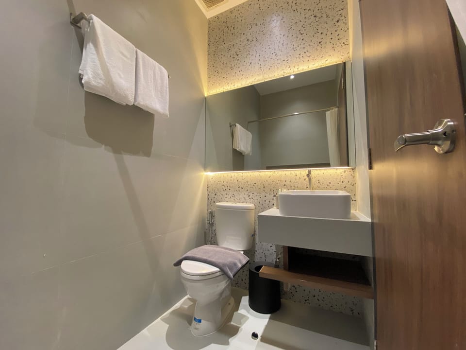 Shower, slippers, towels, soap