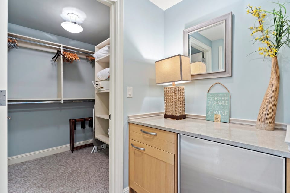 Organize your wardrobe in this roomy closet with ample shelving and hanging space