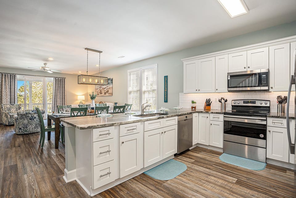 Enjoy a bright, fully stocked kitchen with modern appliances—perfect for family meals and coastal gatherings.