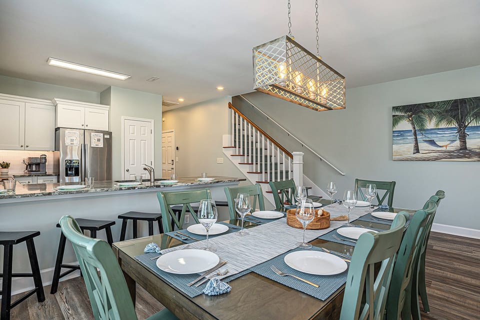 Enjoy effortless vacation living in this open-concept layout with a stylish dining area and spacious kitchen.