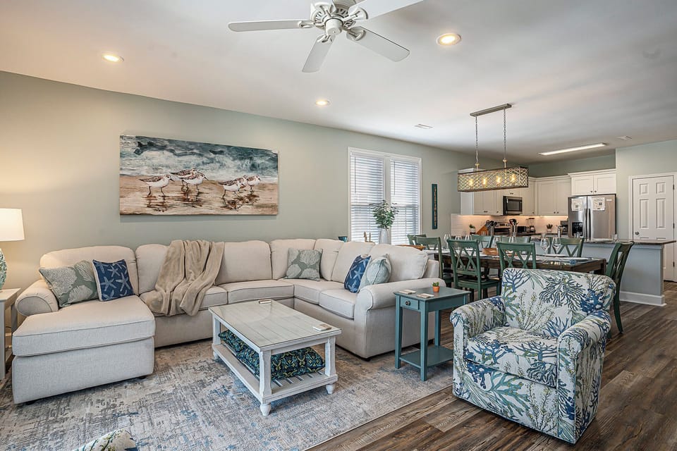 Fresh coastal décor, tons of seating, and an open layout that brings everyone together.
