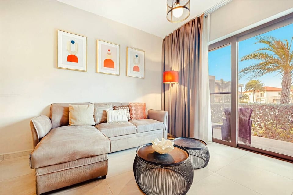 A cozy and stylish living area with plenty of natural light—perfect for relaxing after a day out, enjoying quiet moments, or spending time together comfortably.