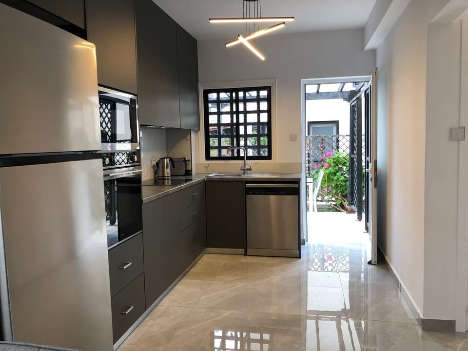 Spacious kitchen leads to outside patio area
