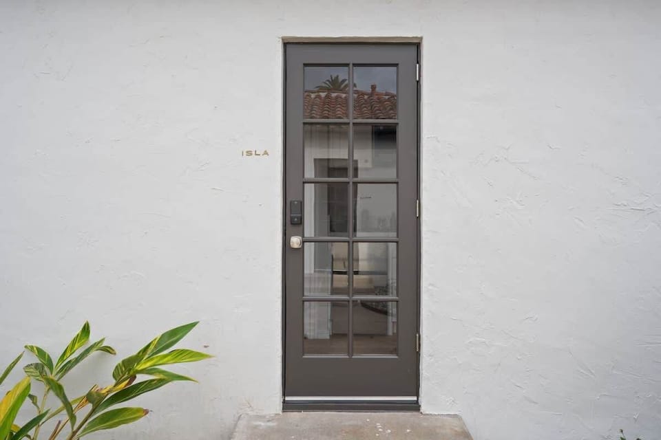 The door way to Isla! a beautiful exterior view of Isla's Entry Front Door with Smart lock! 