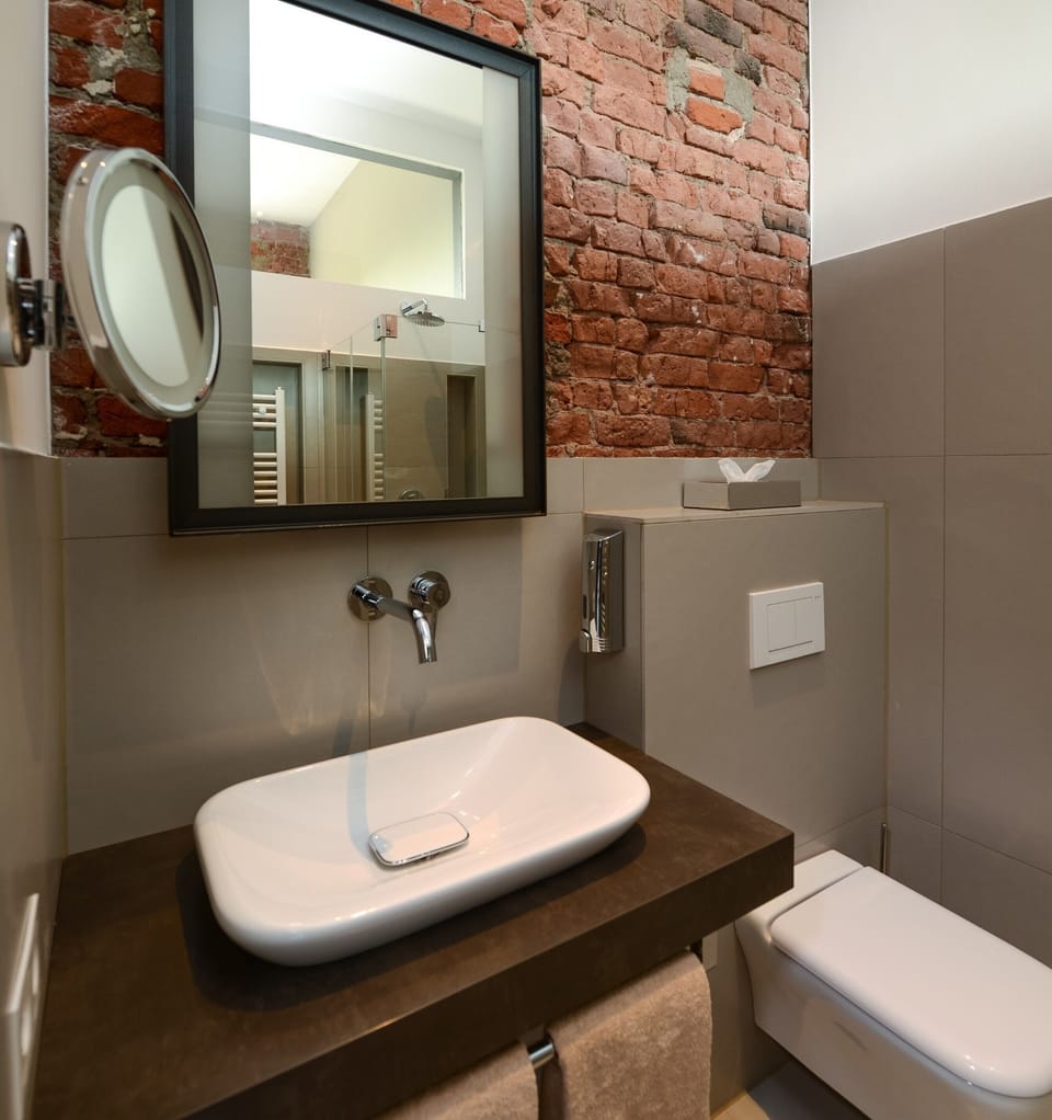 Shower, rainfall showerhead, slippers, towels