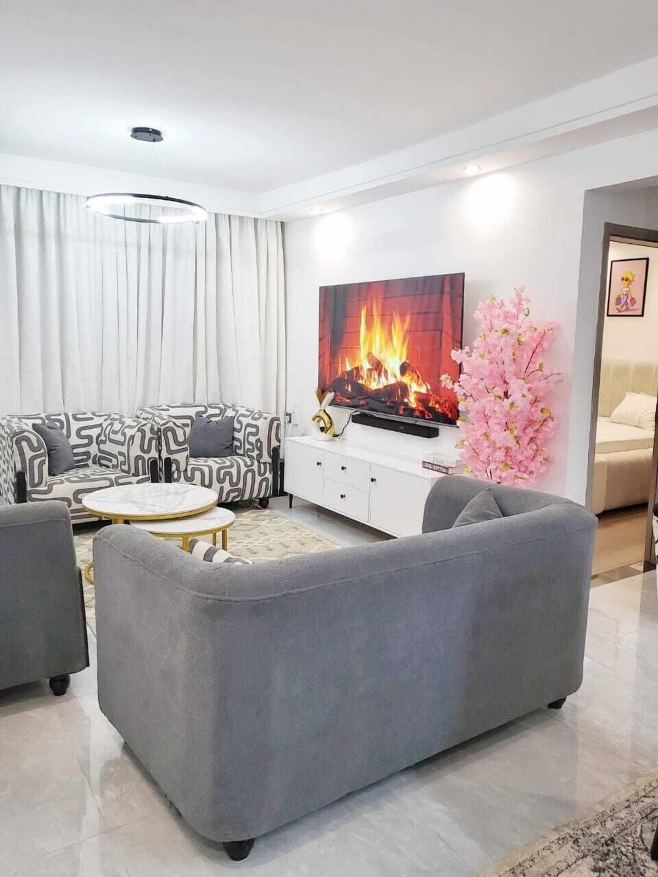 Deluxe Apartment, City View | Living area | 32-inch Smart TV with digital channels