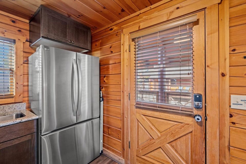 Tucked in the corner of the kitchen, the French-door fridge keeps all your favorites chilled and ready. A perfect spot to grab a snack before stepping out to the deck or back inside for dinner prep.