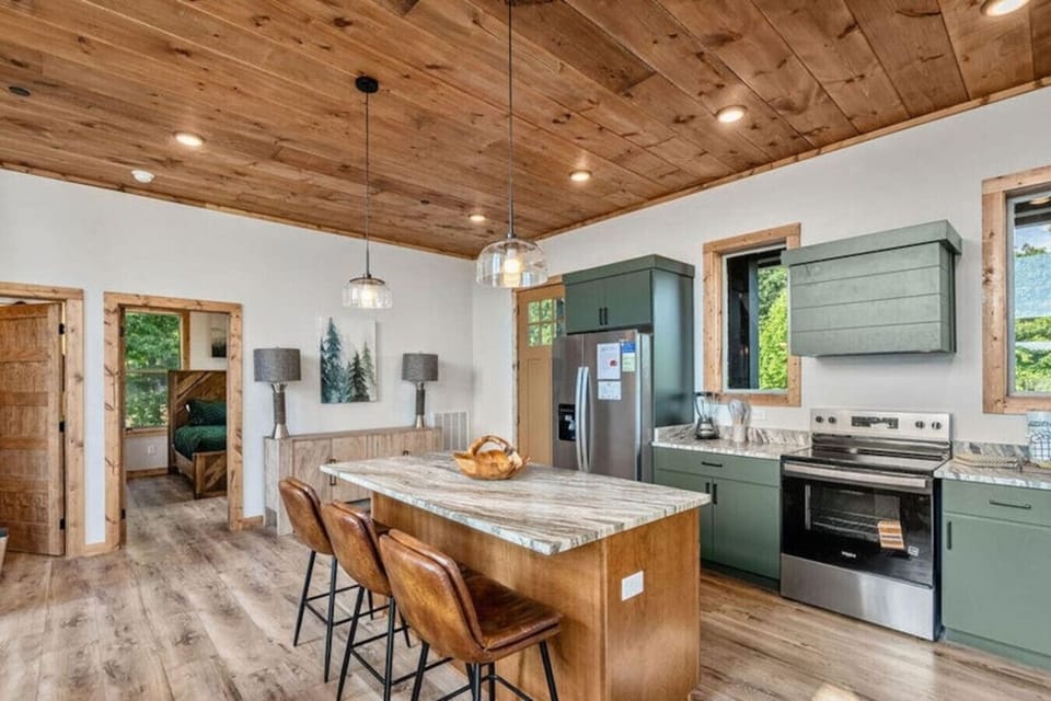 Whether it’s pancakes in the morning or late-night snacks, the oversized island becomes the heart of the home. Plenty of seating keeps everyone connected while meals come together.