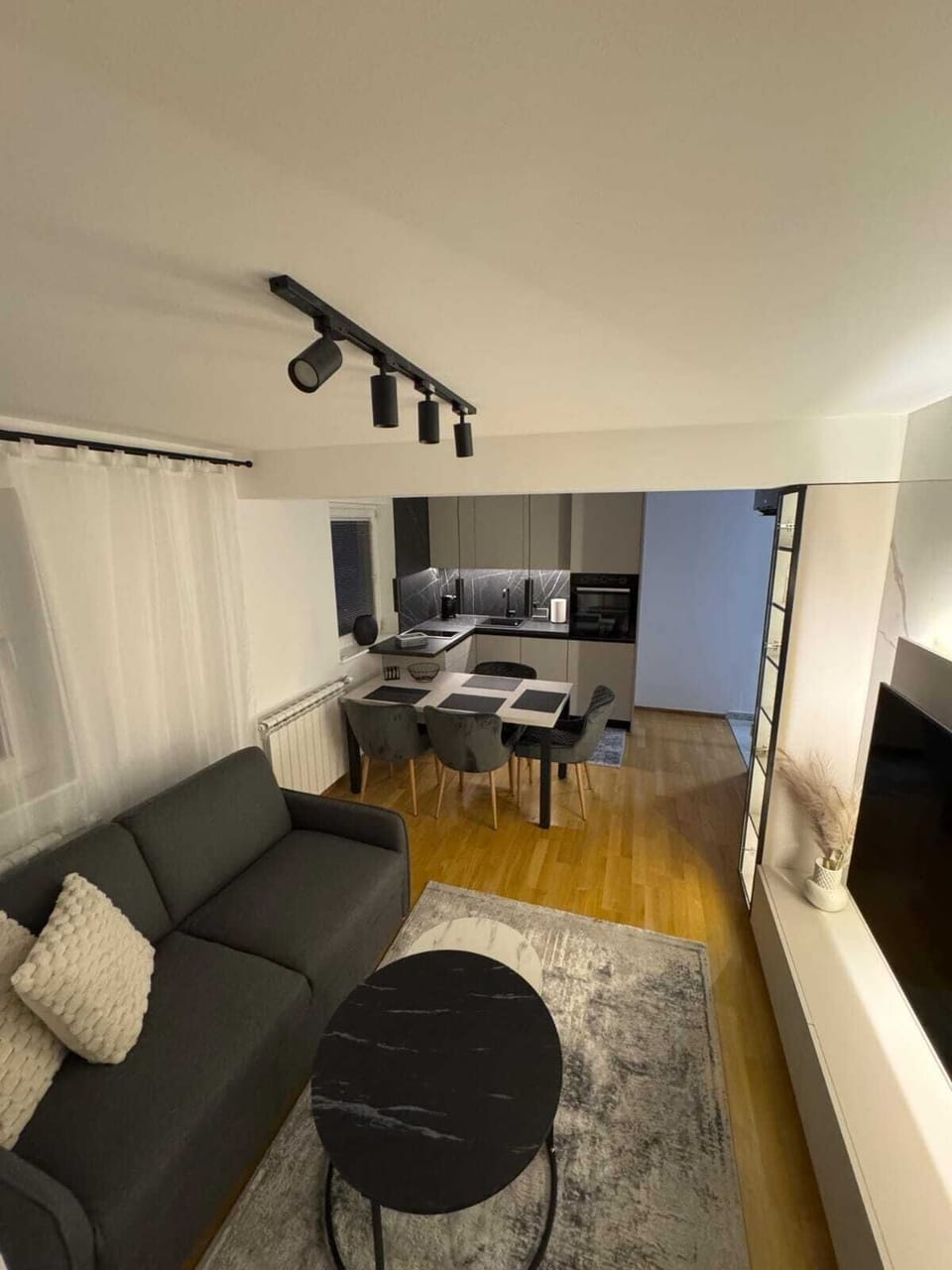 Luxury Apartment, Balcony, Garden View | Living area | 55-inch LED TV with cable channels