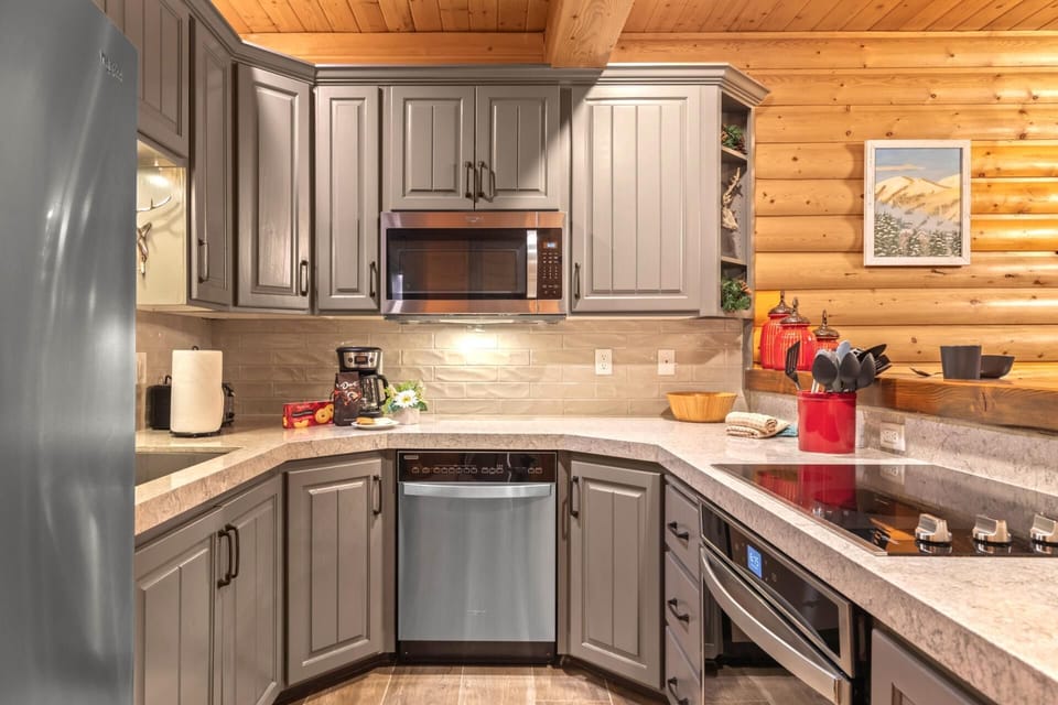 This fully equipped kitchen features granite countertops, appliances, and bar seating for casual meals and snacks. BBL-351B