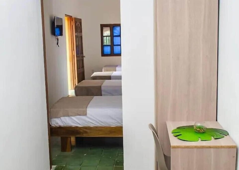 Deluxe Quadruple Room, Courtyard View | Living area