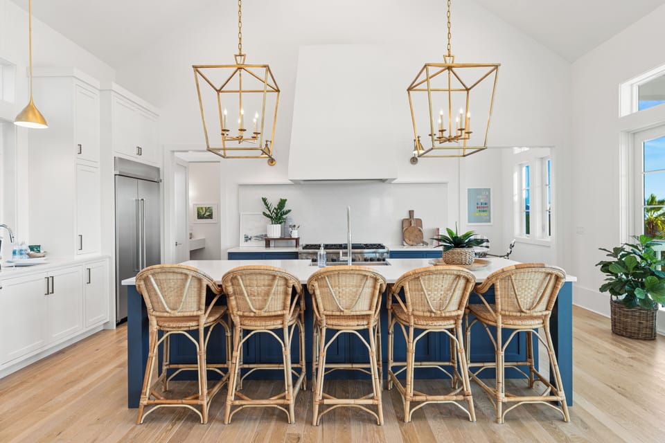 Your spacious kitchen invites culinary adventures with premium appliances, elegant island seating, and warm natural light streaming through.