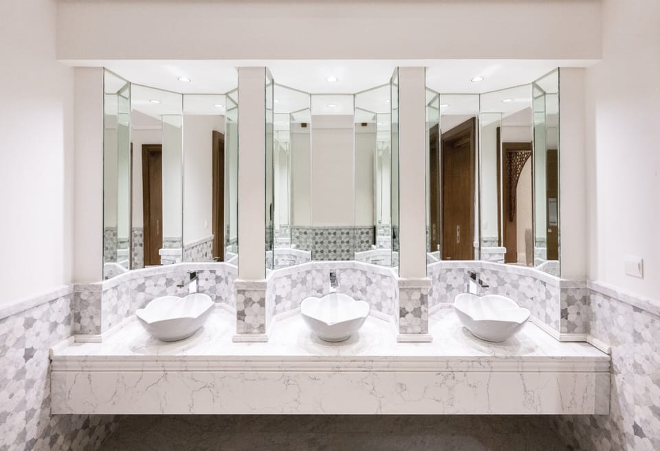 Grand Suite, 1 King Bed | Bathroom | Shower, rainfall showerhead, hair dryer, slippers