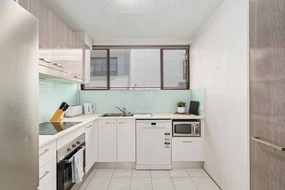 The kitchen provides a perfect setting for easy meal preparation with full appliances, ample storage and everything required for simple at-home cooking.