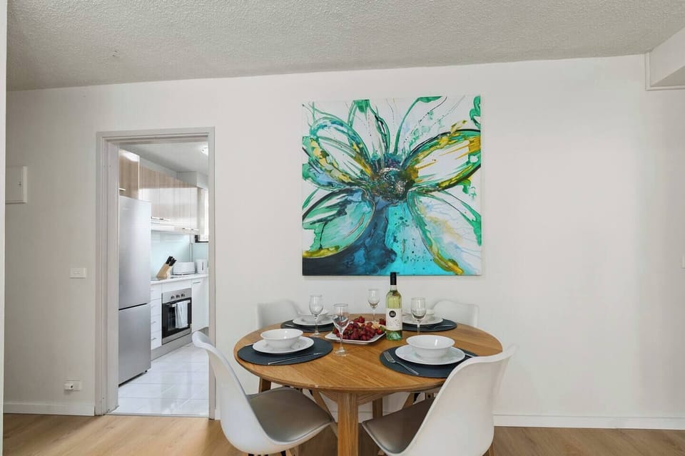 The dining nook offers a warm spot to gather around the timber table for unhurried breakfasts or casual evening meals after a day out.