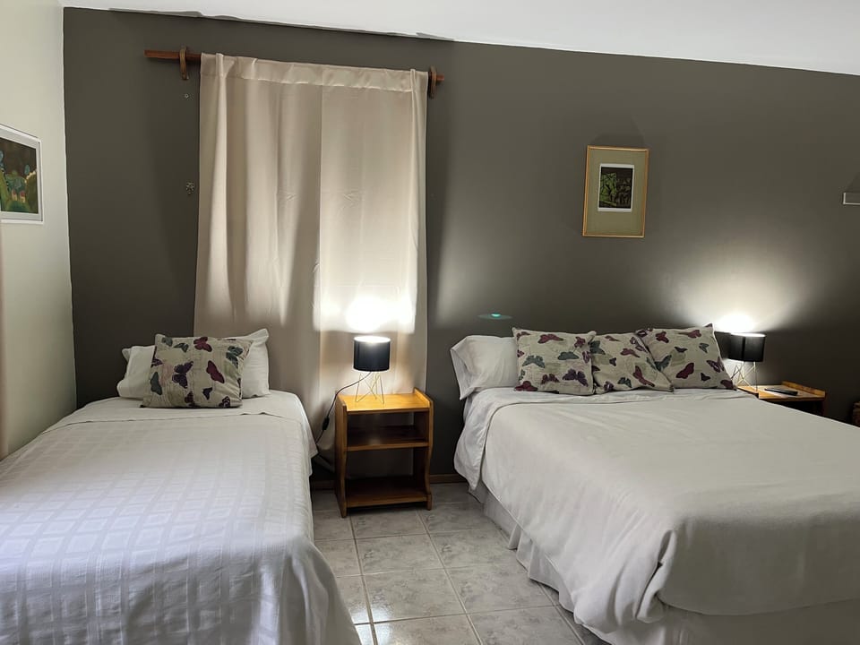 Superior Triple Room, Garden View | In-room safe, laptop workspace, WiFi (free), bed sheets
