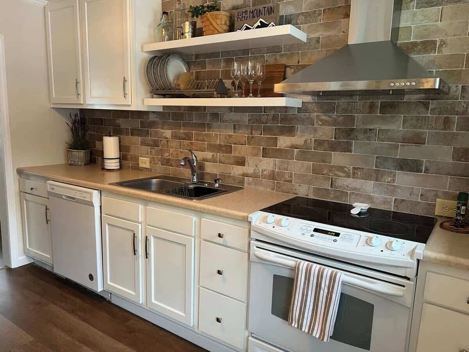 The new kitchen has an electric stove, dishwasher and large refrigerator. All cooking essentials are provided. There is also a single serve and drip coffee maker. 