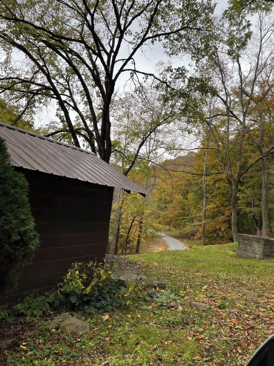 Once you enter the gate you will see a couple small buildings, rock walls and wild flowers along the driveway. 