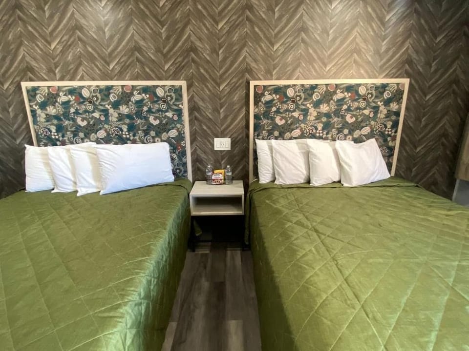 Deluxe Quadruple Room, 2 Queen Beds | Free WiFi