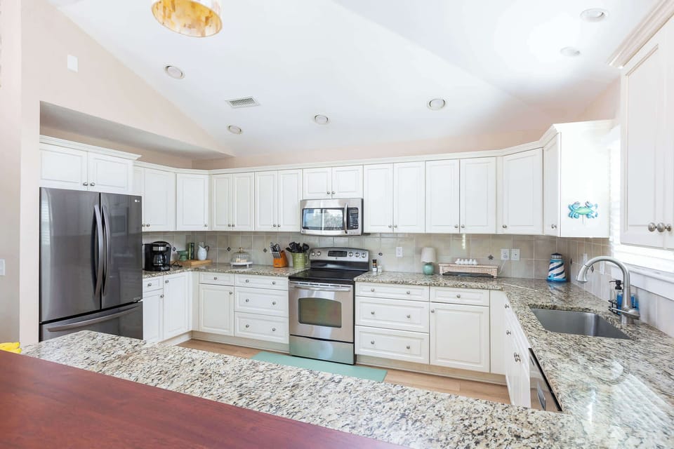 Top Level: Fully-stocked Kitchen featuring stove, refrigerator, oven, microwave, toaster, drip, Keurig, blender, hand mixer and much more