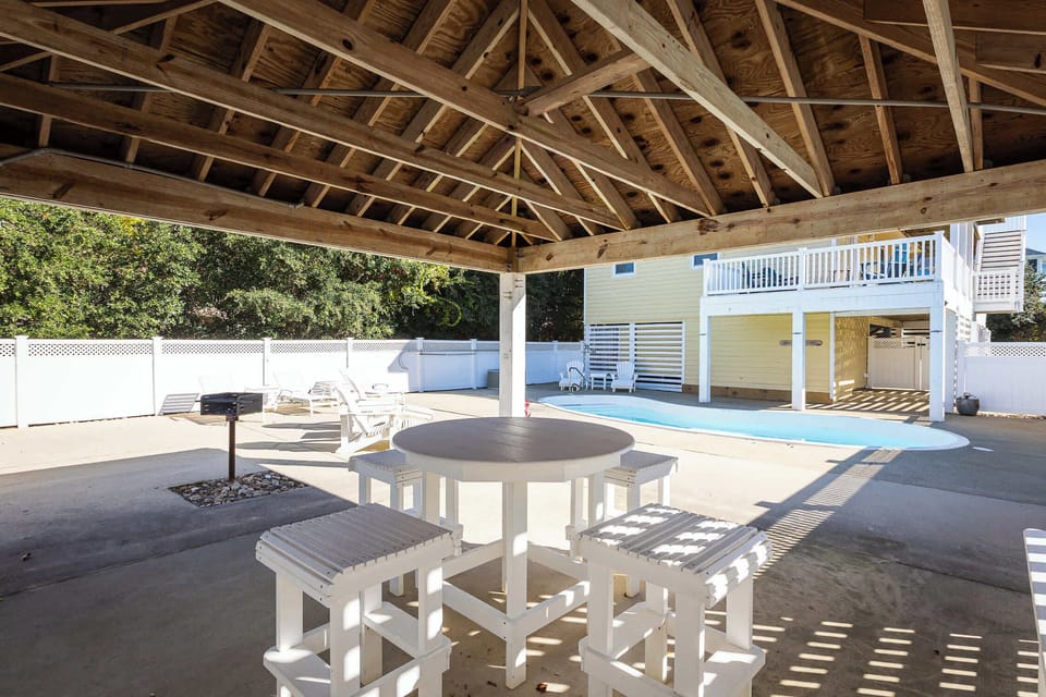 Outdoor: Private fenced pool (non-heated), Covered gazebo area w/ outdoor seating, Sun loungers, Propane & charcoal grill and Outdoor shower