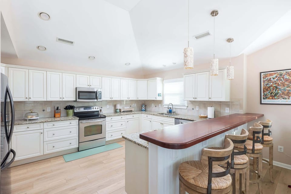 Top Level: Fully-stocked Kitchen featuring stove, refrigerator, oven, microwave, toaster, drip, Keurig, blender, hand mixer and much more