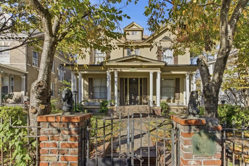 Arrive at this charming historic home framed by trees and classic Southern architecture.