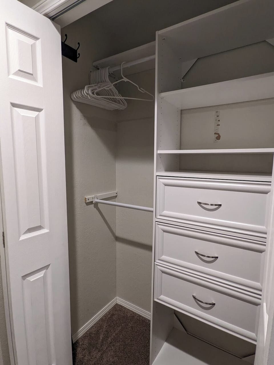 Newly remodeled master bath with rain shower head and ample storage.