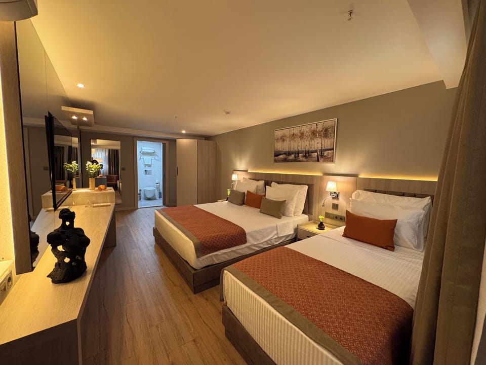 Family Room | Down comforters, Select Comfort beds, minibar, in-room safe