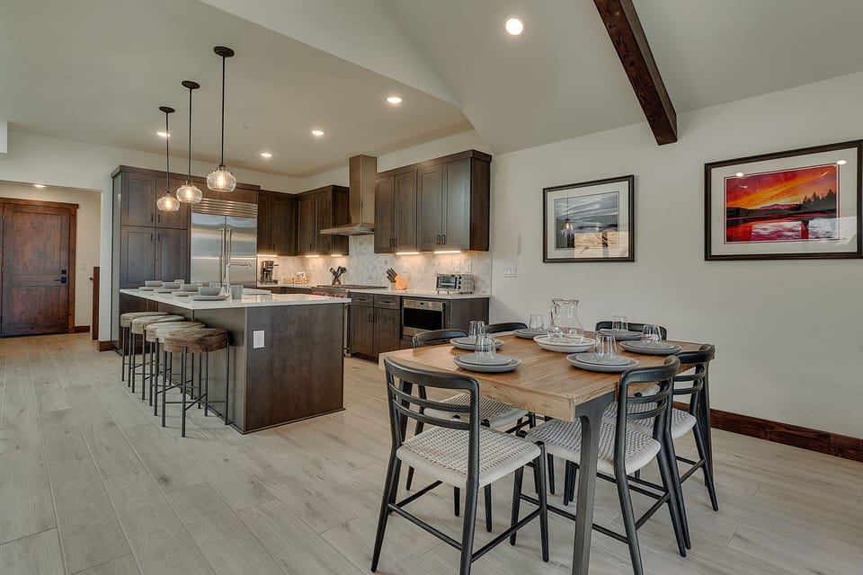 Dining and kitchen area with stainless steel appliances