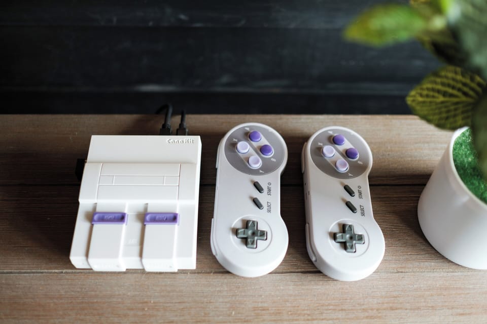 A nostalgic gaming station featuring classic consoles and controllers—perfect for relaxed indoor evenings or friendly competitions.