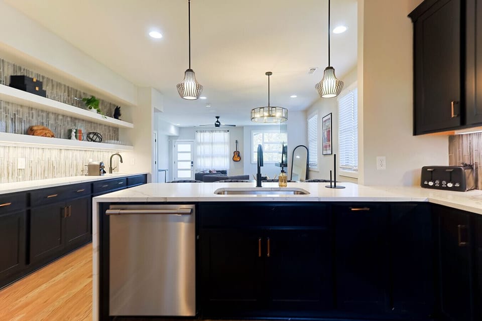 Expansive kitchen island featuring a deep sink.