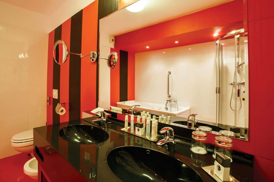 Suite, 1 King Bed (Duplex) | Bathroom | Shower, hair dryer, bathrobes, slippers