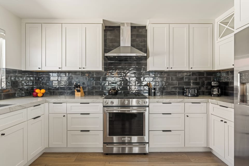 Fully stocked kitchen with reliable appliances and ample counter space for meal prepping. (Unit 1)
