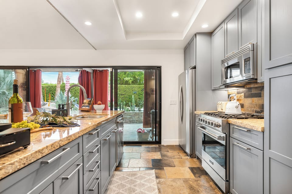 Kitchen features stainless steel appliances.