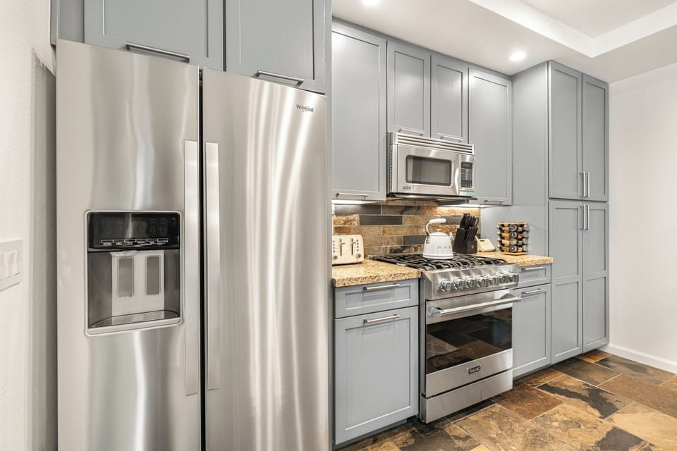 Kitchen equipped with modern appliances.