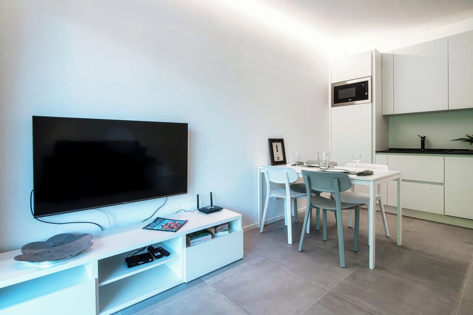 Apartment, Mountain View | Living area | 30-inch TV with digital channels