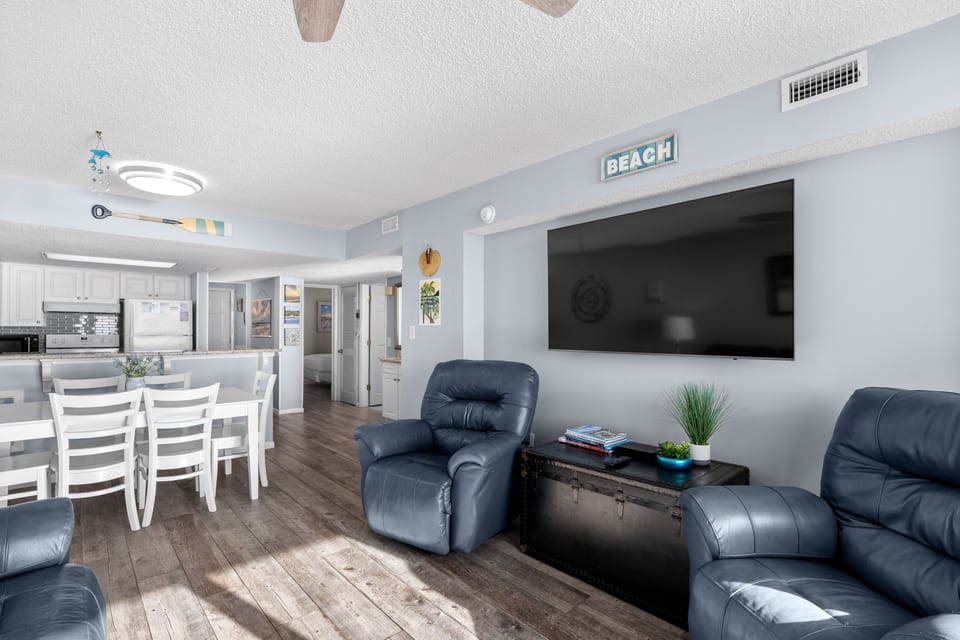 Large Smart TV that can be viewed from Living Room and Dining Room  Area