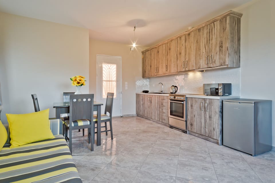 Luxury Apartment, Sea View, Ground Floor (Village View) | Private kitchen | Fridge, microwave, stovetop, coffee/tea maker