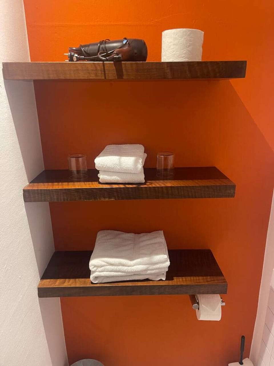 Modern Bathroom with Towels, Hairdryer and Body Soap